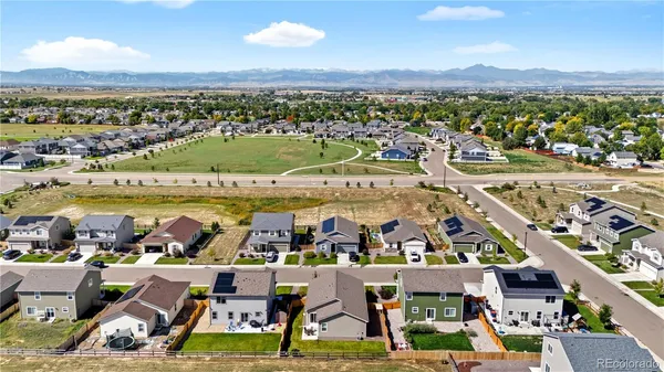 a view of multiple houses with outdoor space