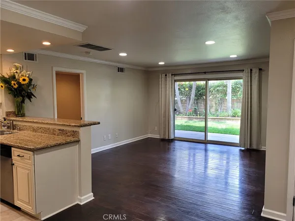 a kitchen with stainless steel appliances a refrigerator and a stove top oven