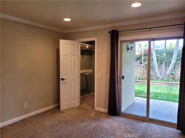 an empty room with a empty space and windows