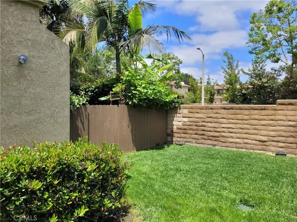 a view of a house with a yard and plants