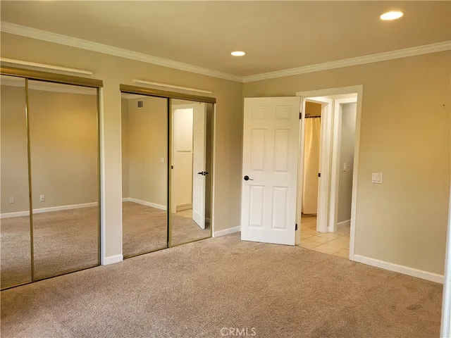 an empty room with sliding glass door