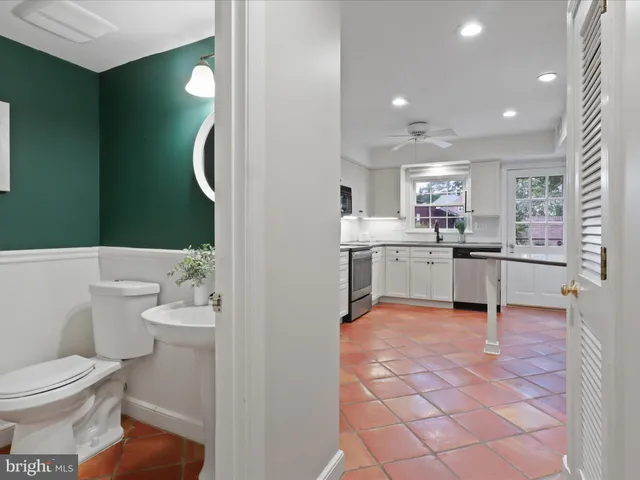 a kitchen with a sink cabinets and appliances