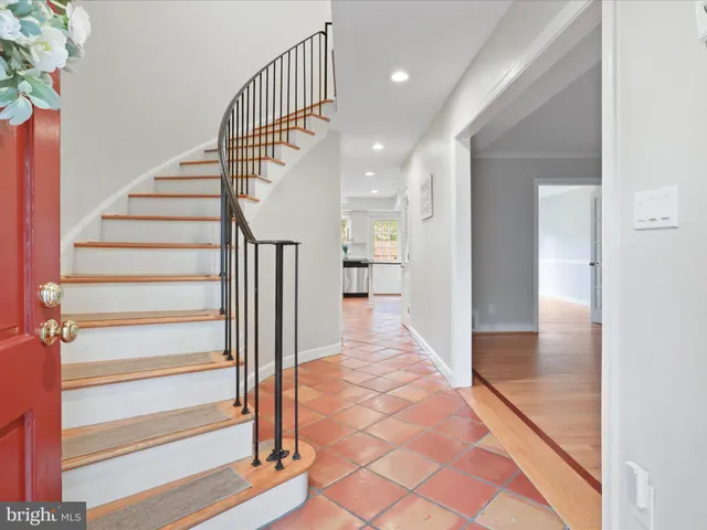 a view of entryway with wooden floor and a livingroom view