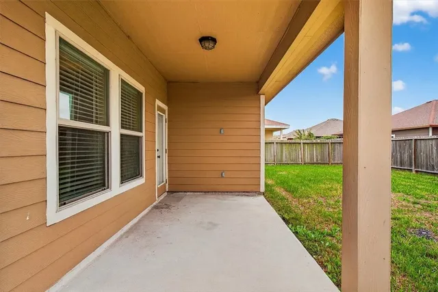 a view of a house with backyard and porch