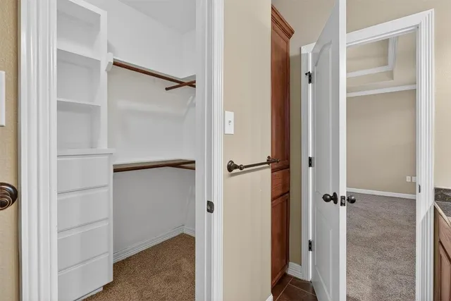 a view of an empty walk in closet