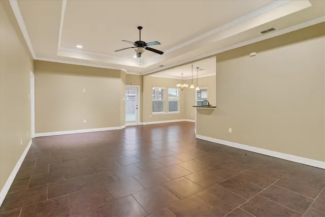 a view of an empty room with glass door
