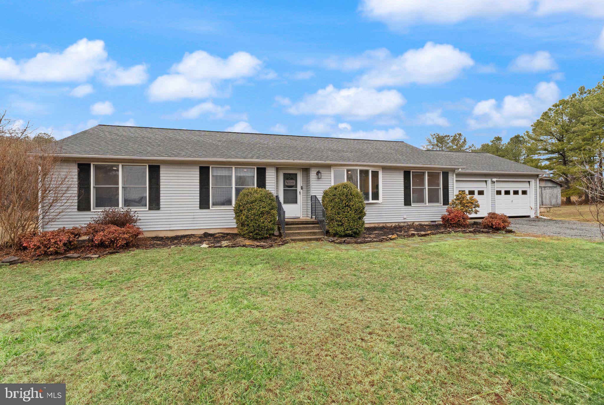14068 Carriage Ford Road Nokesville, VA 20181 - Photo 1 of 48 a view of a house with backyard and sitting area