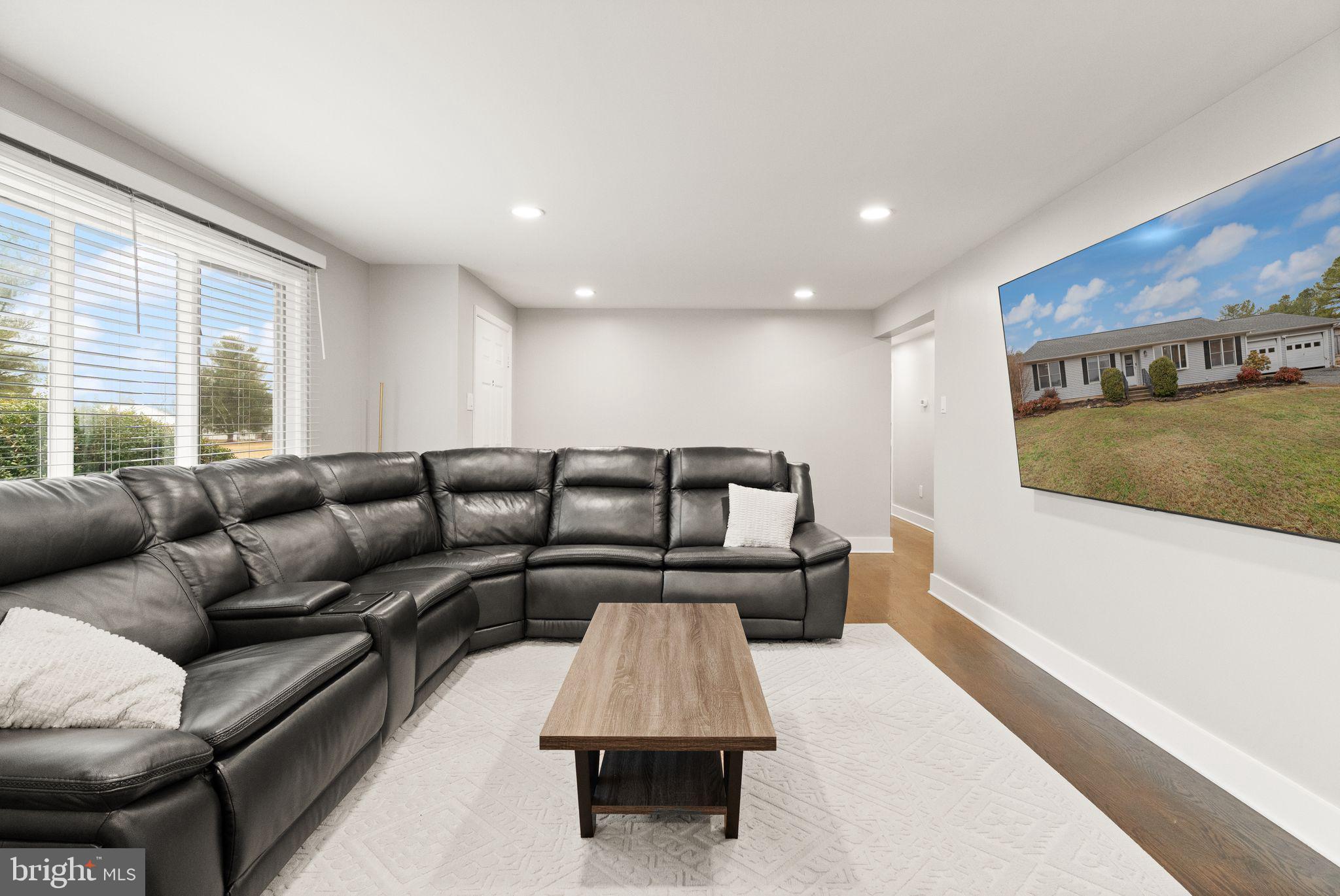 14068 Carriage Ford Road Nokesville, VA 20181 - Photo 12 of 48 a living room with a couch and a rug