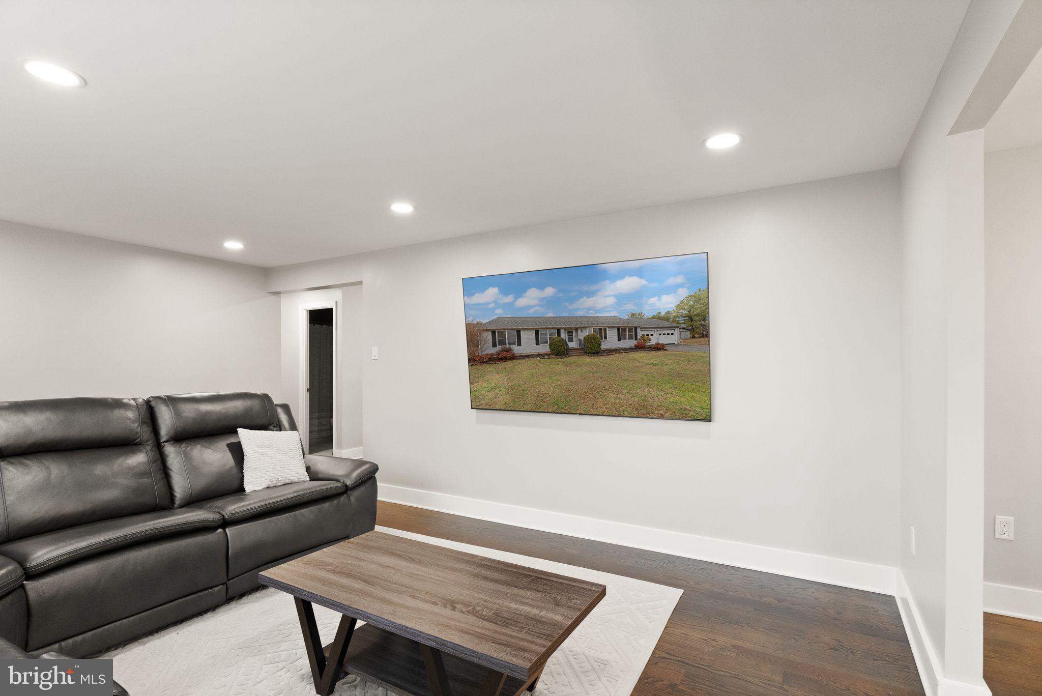 14068 Carriage Ford Road Nokesville, VA 20181 - Photo 13 of 48 a living room with furniture and a rug