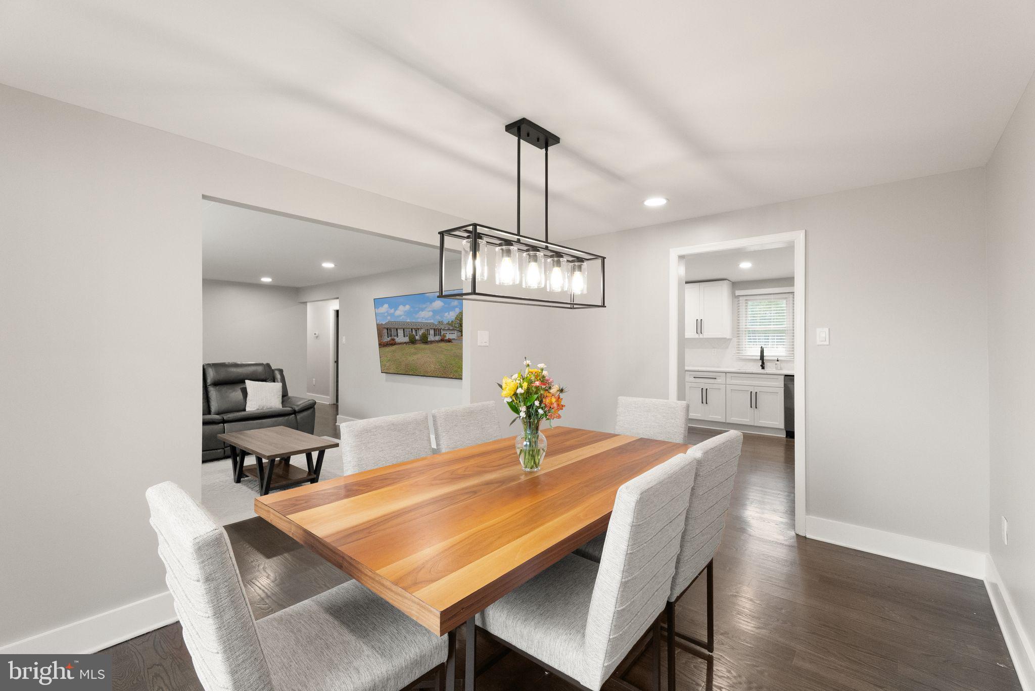 14068 Carriage Ford Road Nokesville, VA 20181 - Photo 14 of 48 a view of a dining room with furniture wooden floor and chandelier