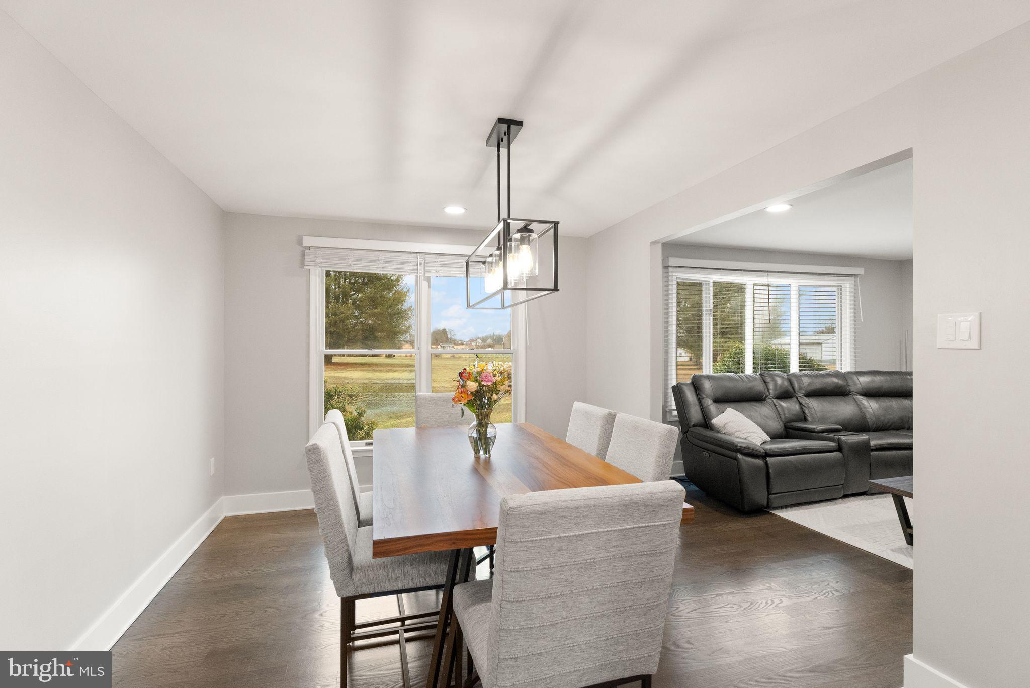 14068 Carriage Ford Road Nokesville, VA 20181 - Photo 15 of 48 a living room with furniture dining table and a window