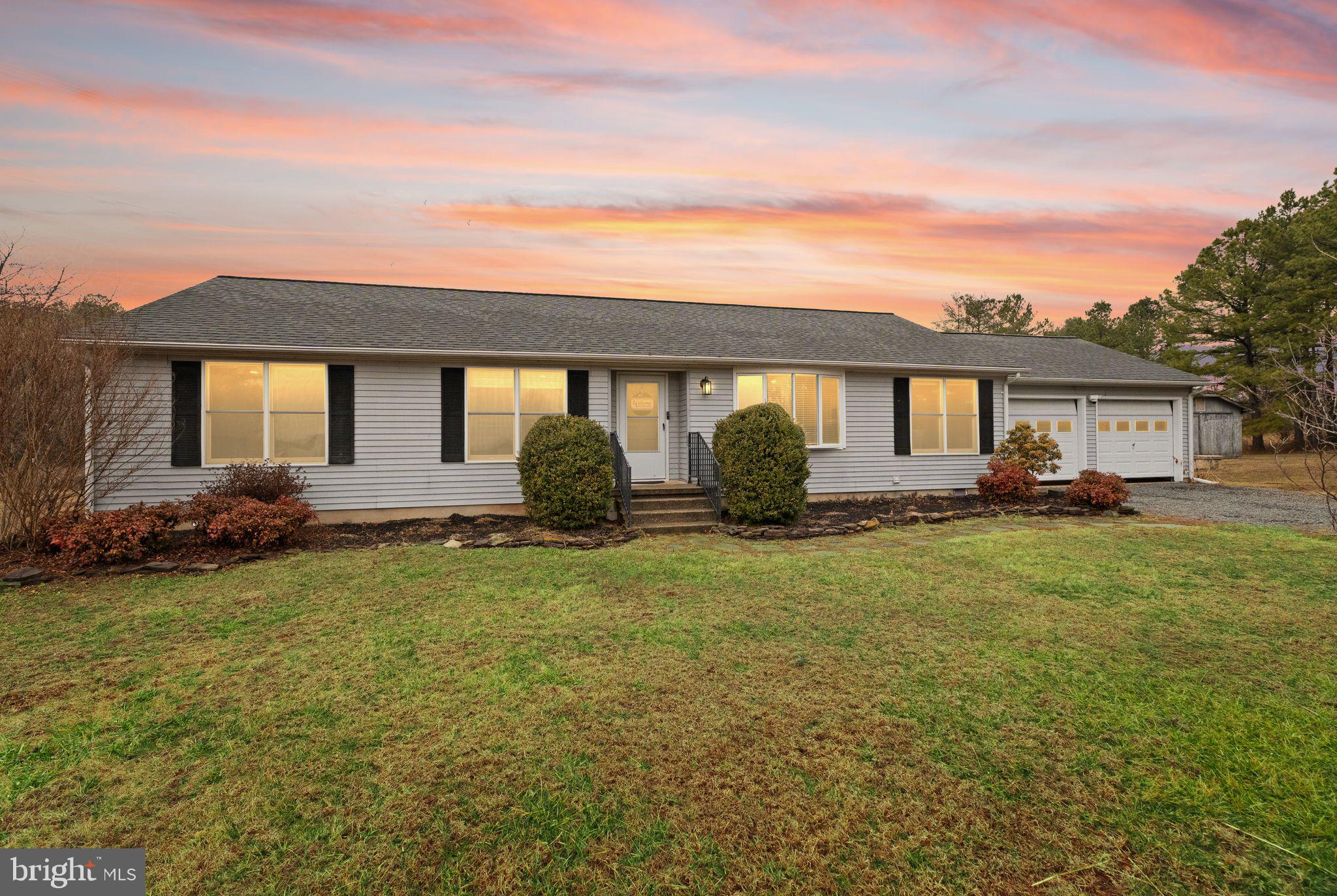 14068 Carriage Ford Road Nokesville, VA 20181 - Photo 2 of 48 a front view of house with yard and outdoor seating