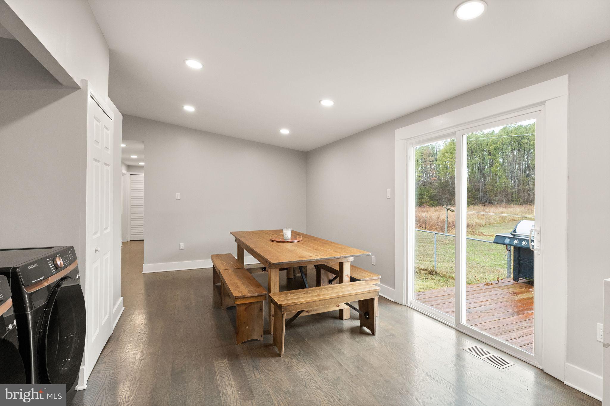 14068 Carriage Ford Road Nokesville, VA 20181 - Photo 21 of 48 a view of a room with furniture wooden floor and a window