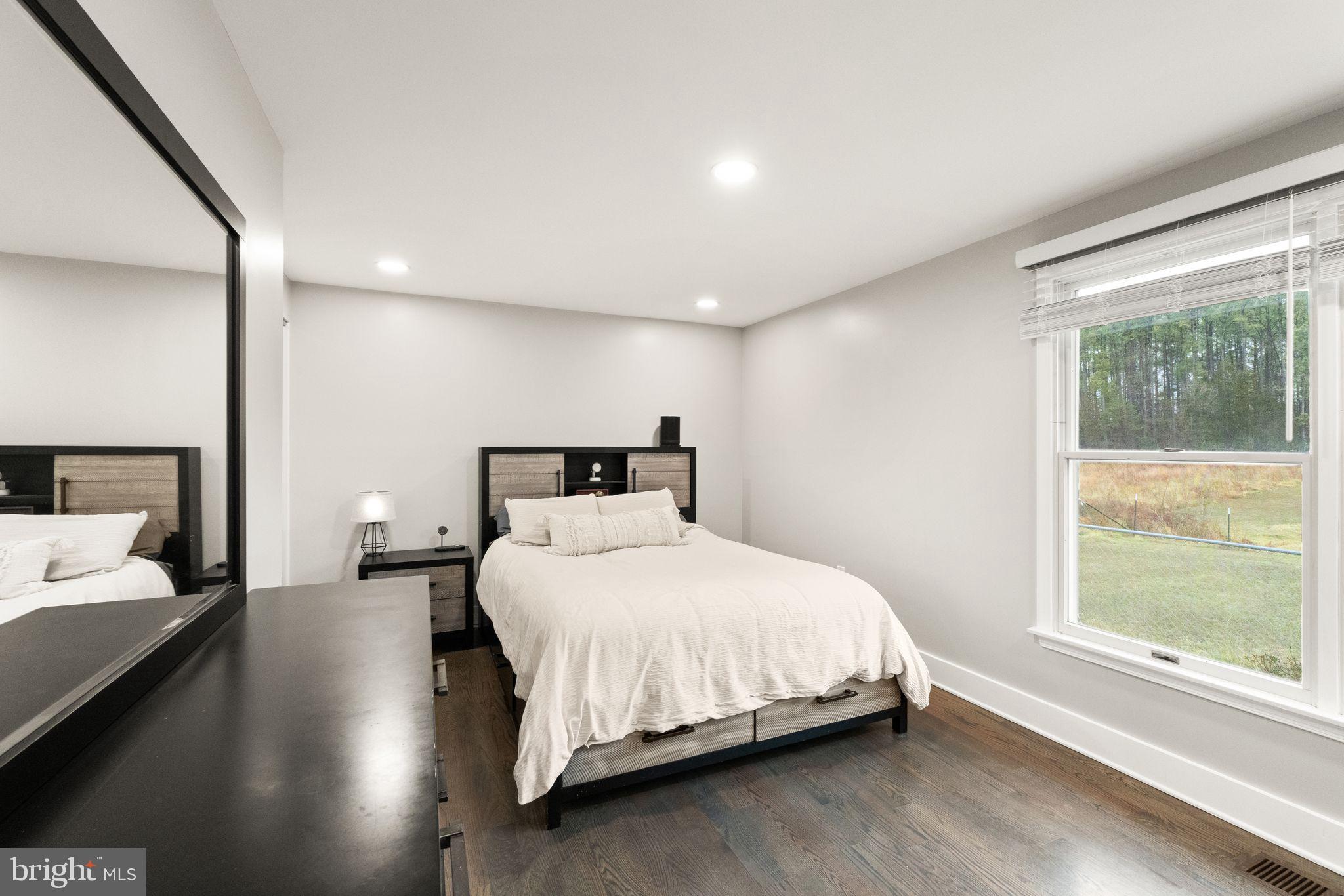 14068 Carriage Ford Road Nokesville, VA 20181 - Photo 22 of 48 a bedroom with a bed and a large window