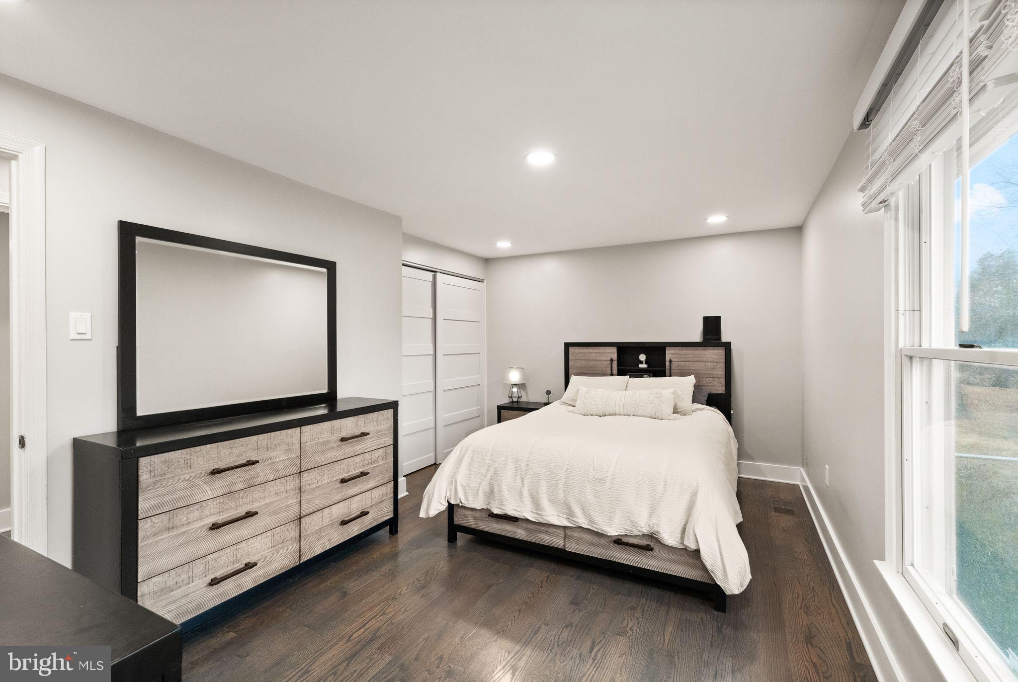 14068 Carriage Ford Road Nokesville, VA 20181 - Photo 23 of 48 a bedroom with a bed and a flat tv screen on dresser