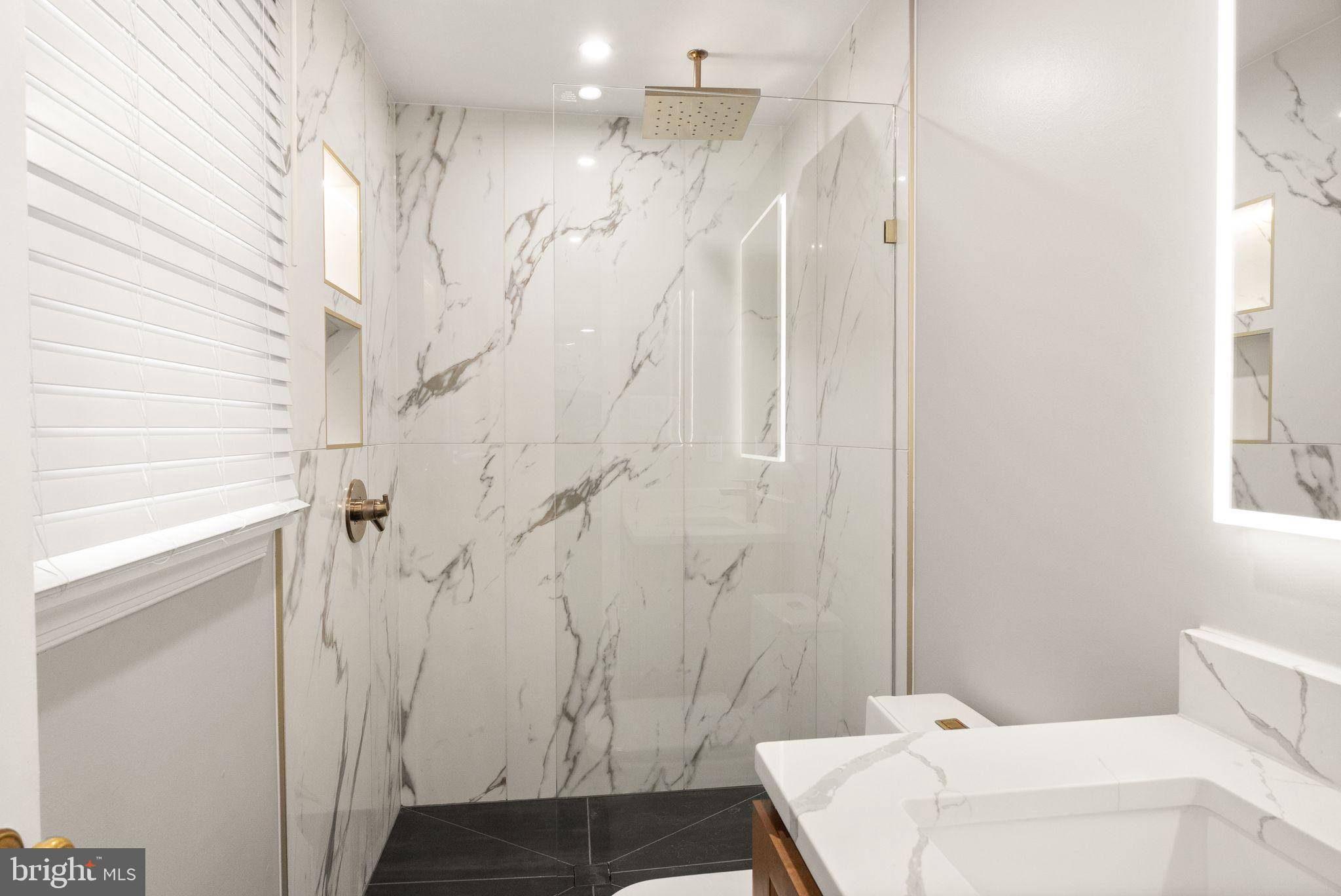 14068 Carriage Ford Road Nokesville, VA 20181 - Photo 26 of 48 a bathroom with a sink and a shower