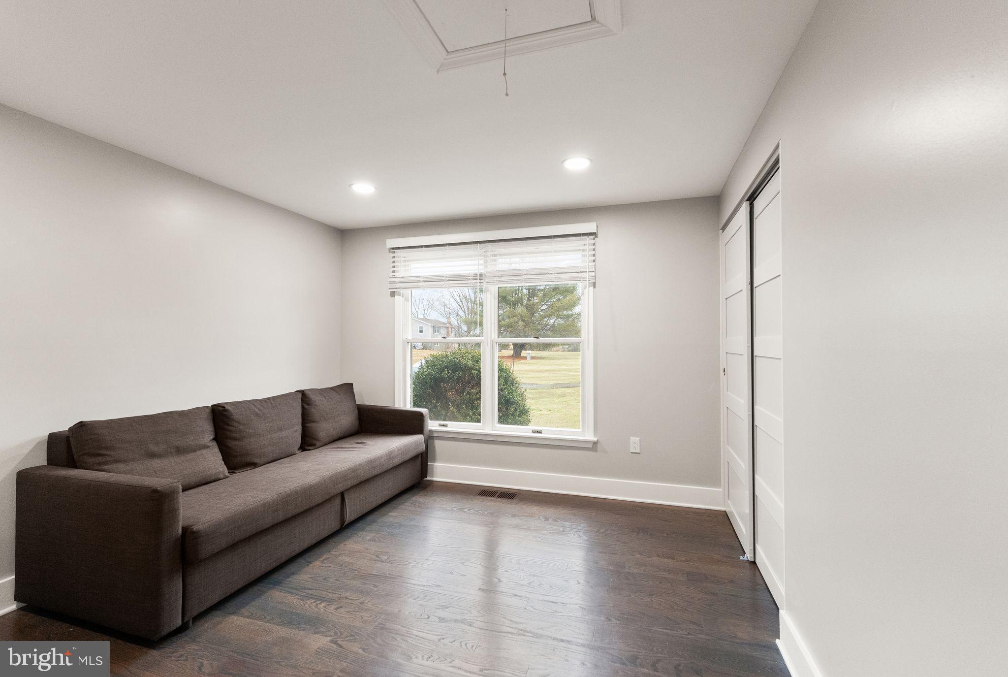 14068 Carriage Ford Road Nokesville, VA 20181 - Photo 30 of 48 a living room with furniture and a large window