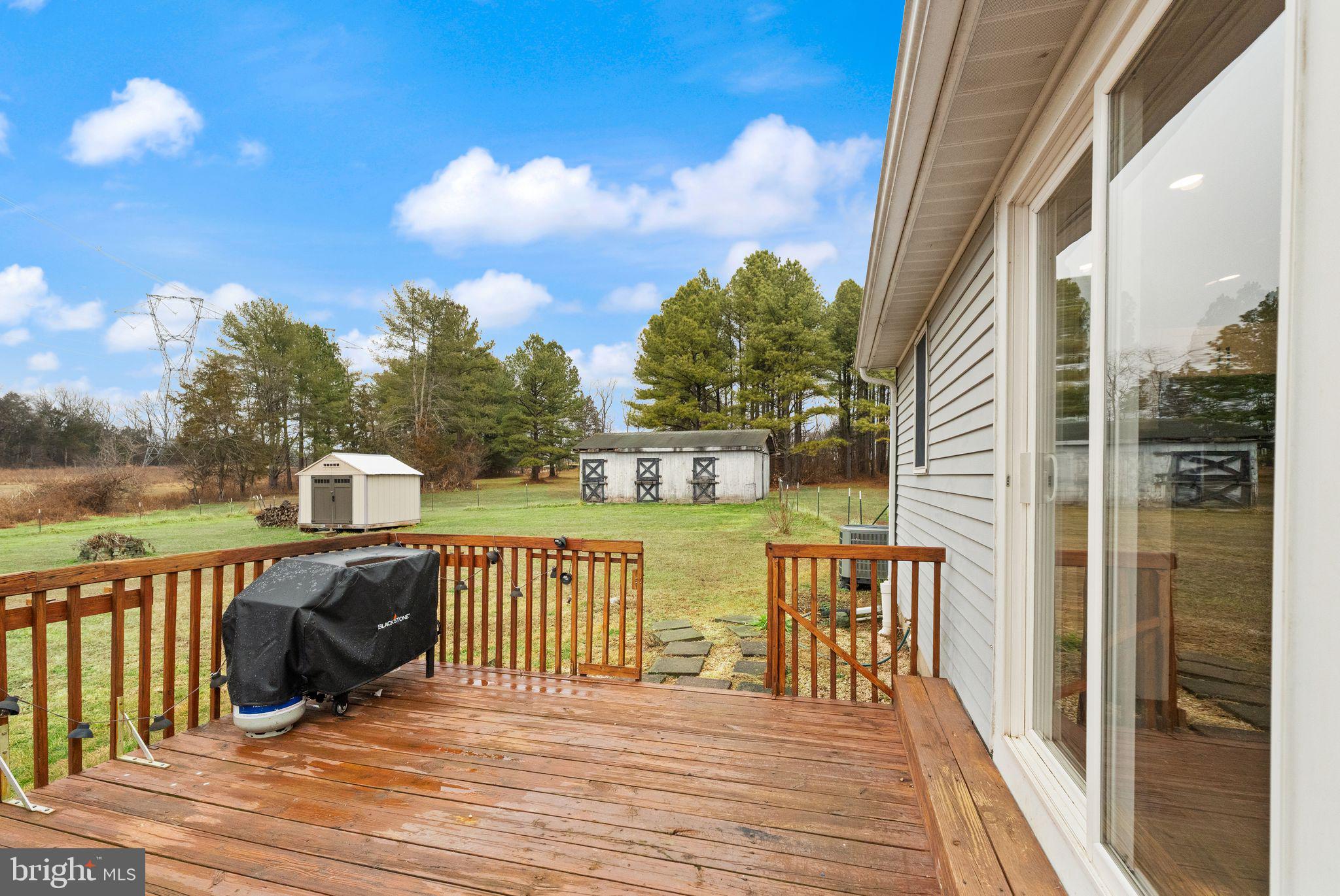 14068 Carriage Ford Road Nokesville, VA 20181 - Photo 34 of 48 a view of a deck with sunset view