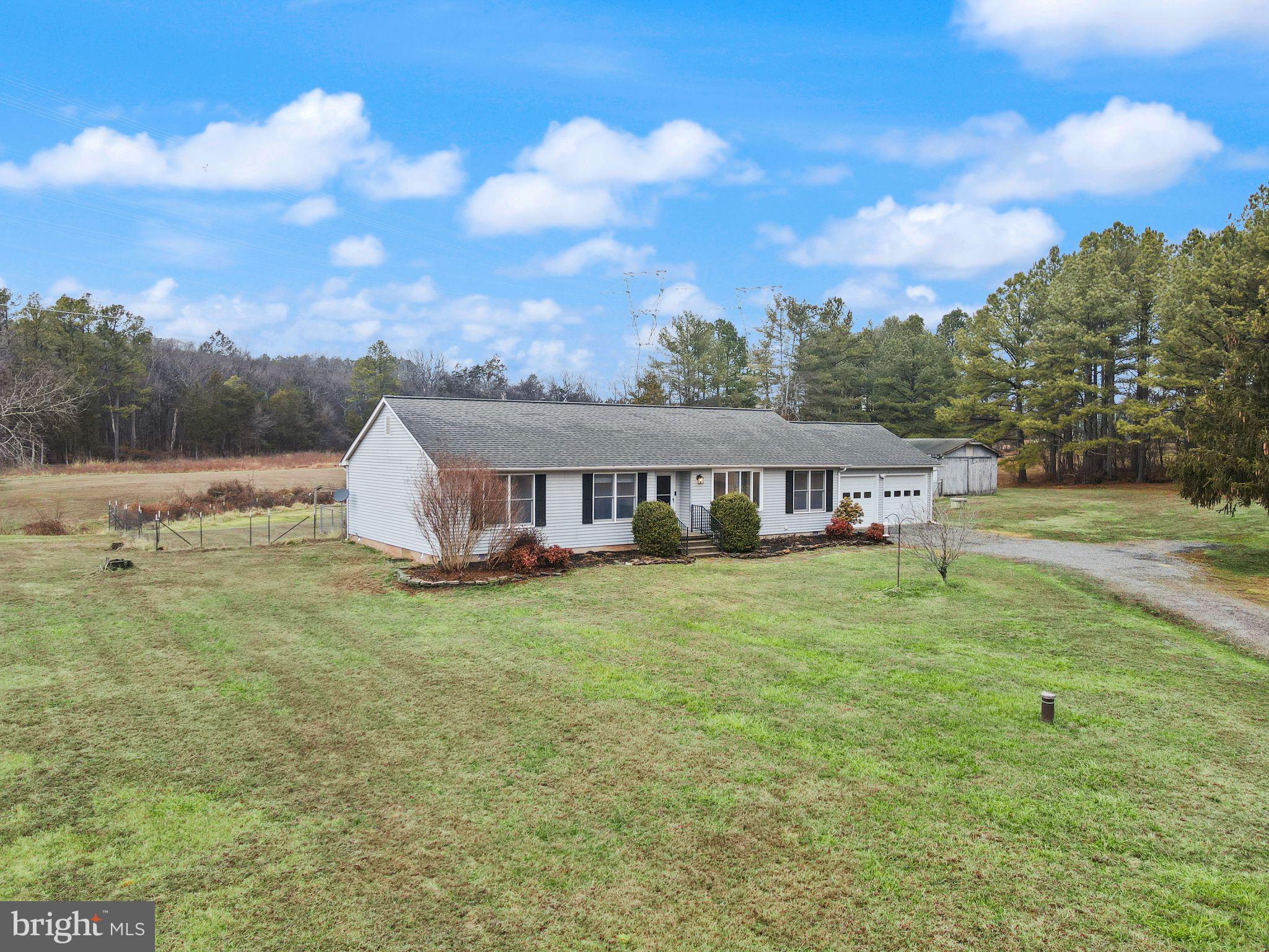 14068 Carriage Ford Road Nokesville, VA 20181 - Photo 5 of 48 a view of a house with backyard and garden