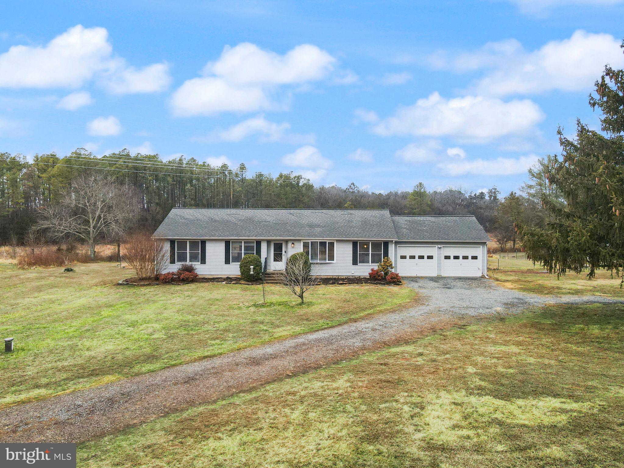 14068 Carriage Ford Road Nokesville, VA 20181 - Photo 6 of 48 a front view of a house with a yard