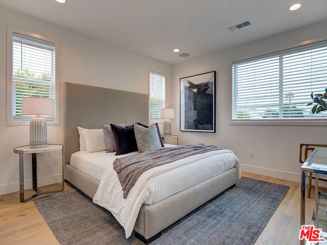 a bed room with a bed and a window