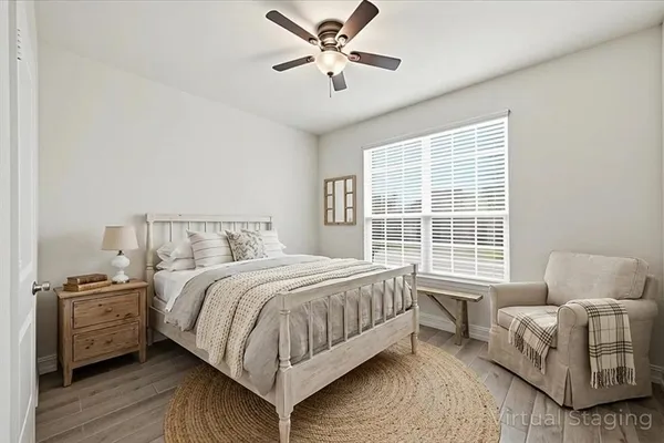 a bedroom with a bed and a couch