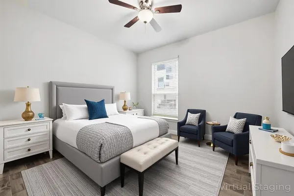 a bedroom with bed and window