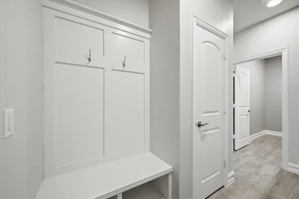 a spacious bathroom with a tub sink and mirror