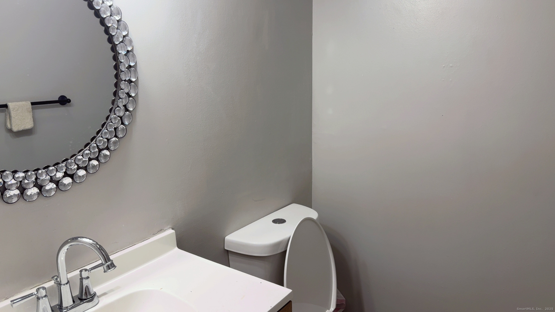 268 High Path Road, Unit 268 Windsor, CT 06095 - Photo 15 of 16 a bathroom with a toilet a sink and mirror