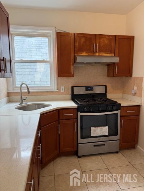 423 Augustine Place, Unit 2 Perth Amboy, NJ 08861 - Photo 2 of 8 a kitchen with granite countertop a stove and a sink