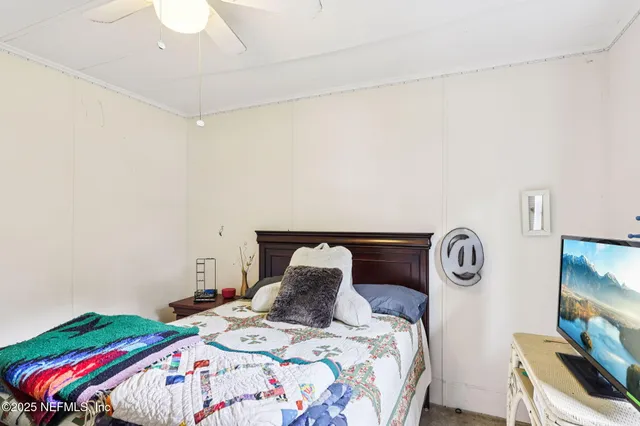 a bathroom with a sink a toilet and shower curtain
