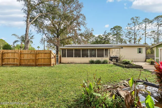 a front view of a house with yard porch and furniture