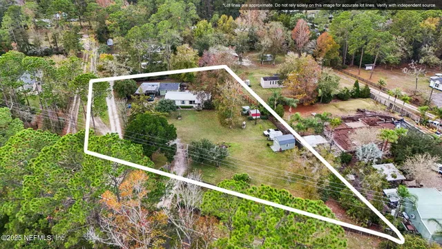a view of a field with a forest