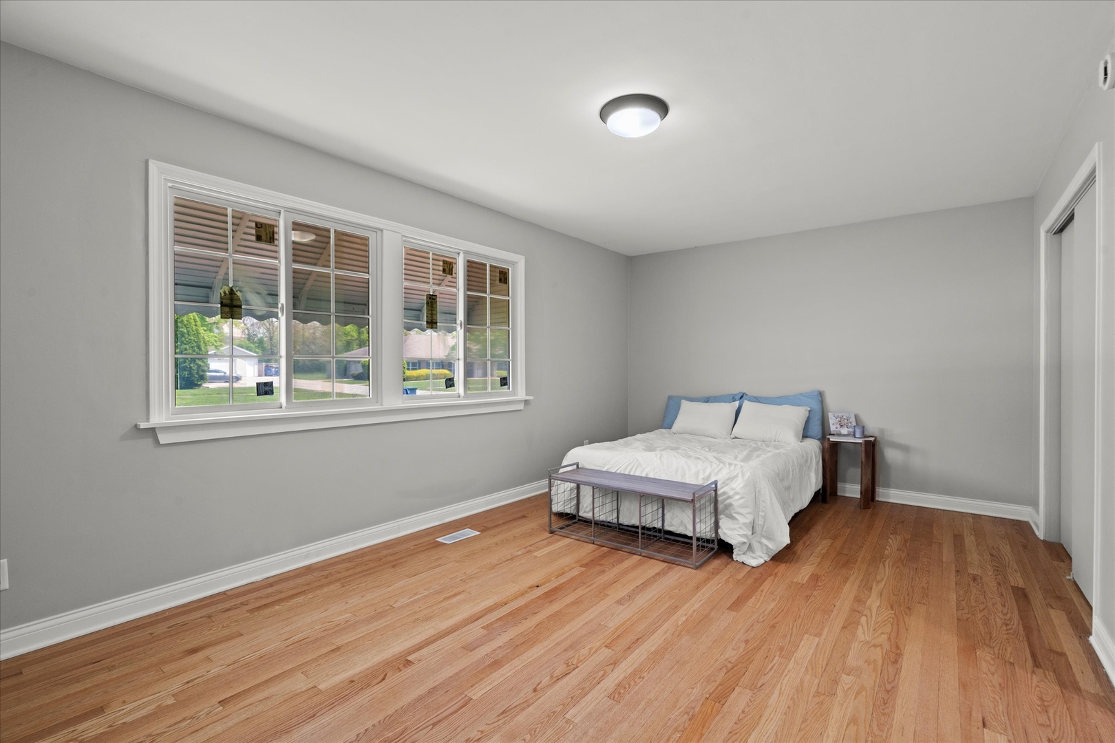 30 Broadway Chicago Heights, IL 60411 - Photo 11 of 25 a spacious bedroom with a bed and a window
