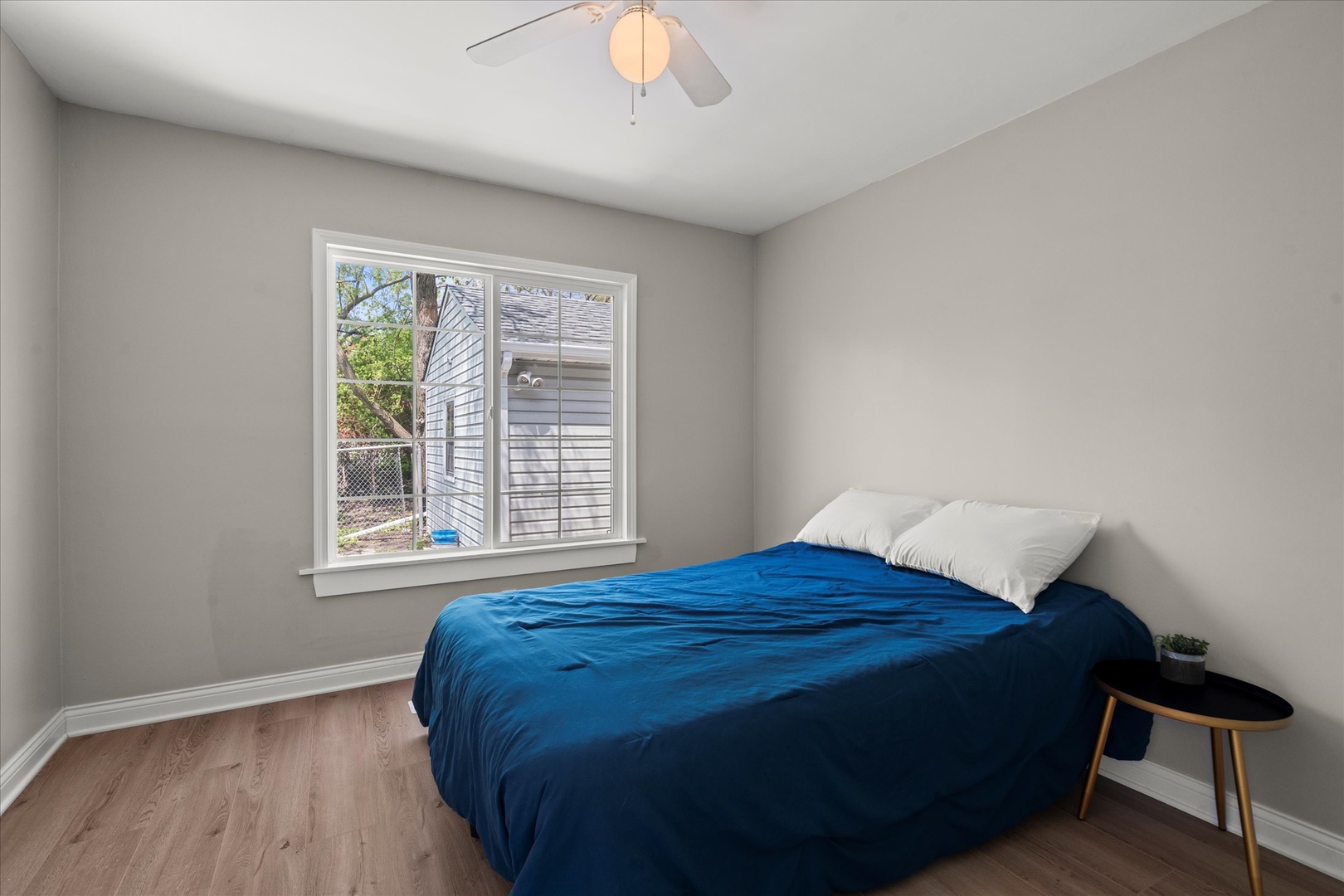 30 Broadway Chicago Heights, IL 60411 - Photo 13 of 25 a bed sitting in a bedroom next to a window