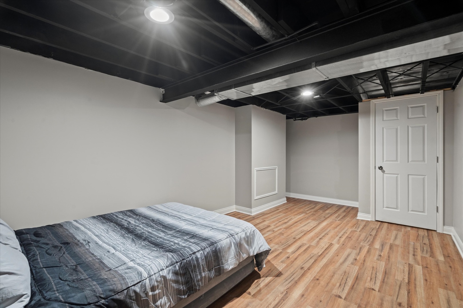 30 Broadway Chicago Heights, IL 60411 - Photo 14 of 25 a bedroom with a bed and a wooden floor
