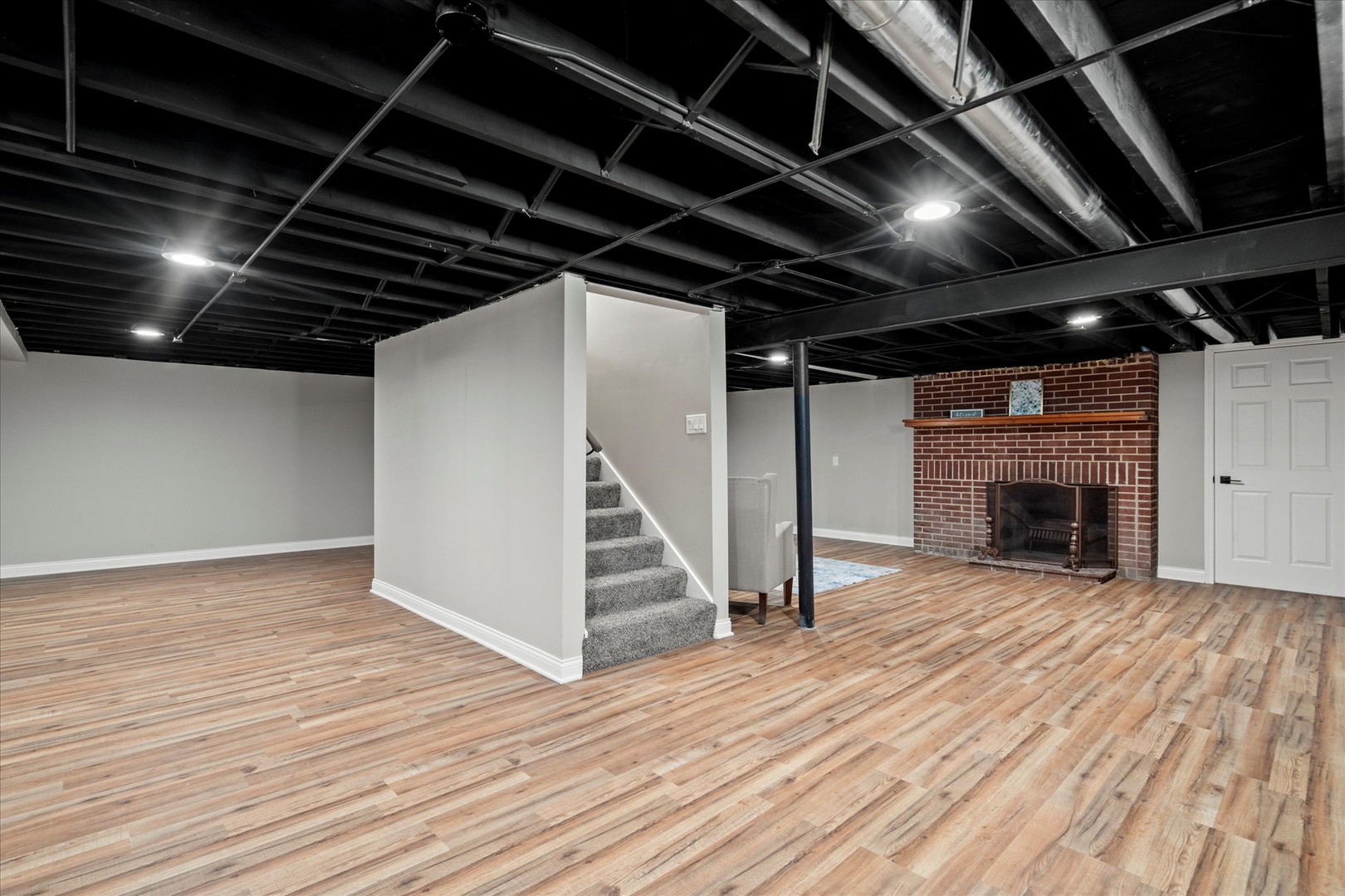 30 Broadway Chicago Heights, IL 60411 - Photo 16 of 25 a view of an empty room with wooden floor a fireplace and a window