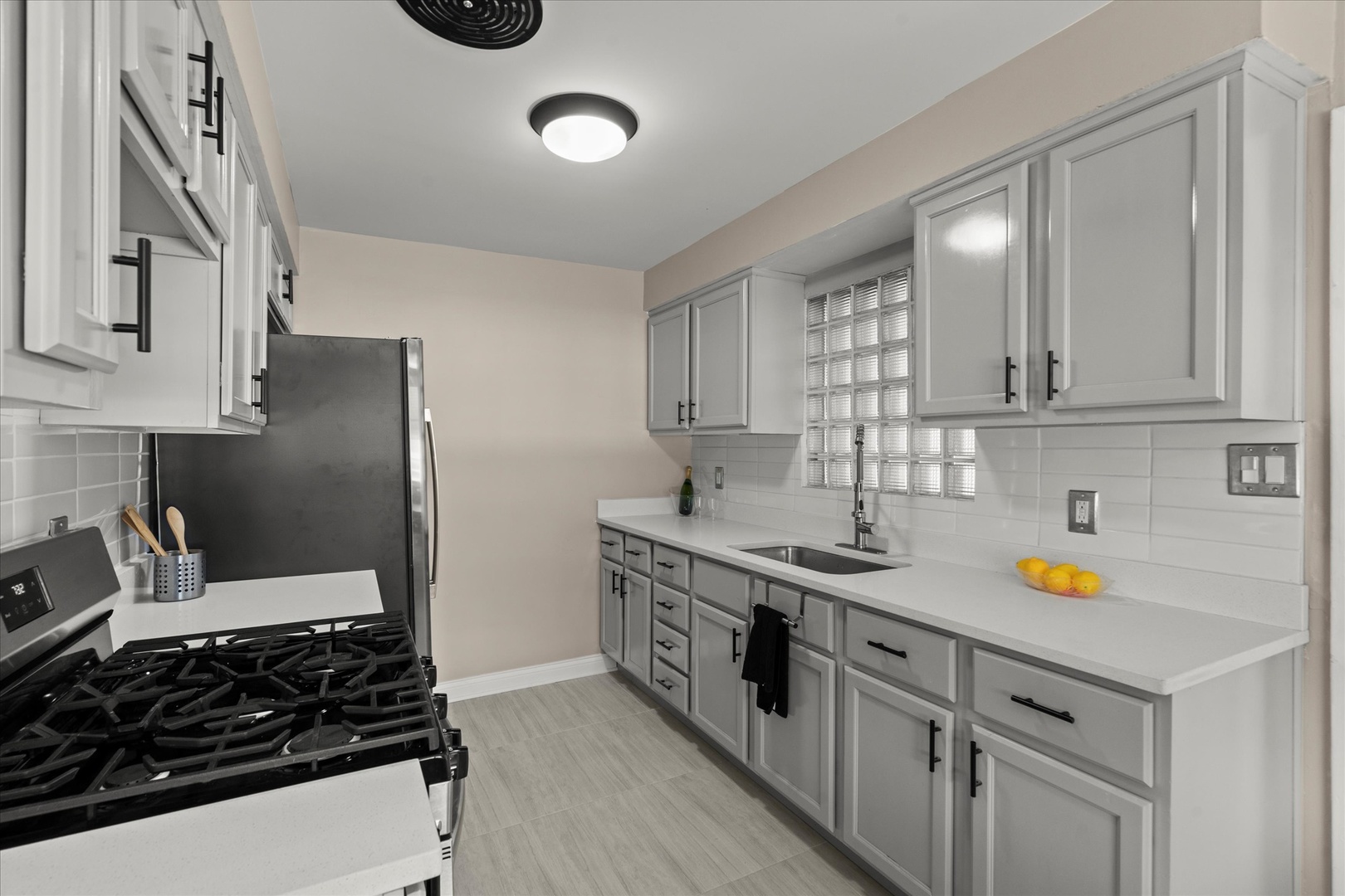 30 Broadway Chicago Heights, IL 60411 - Photo 7 of 25 a kitchen with stainless steel appliances granite countertop a sink stove and cabinets