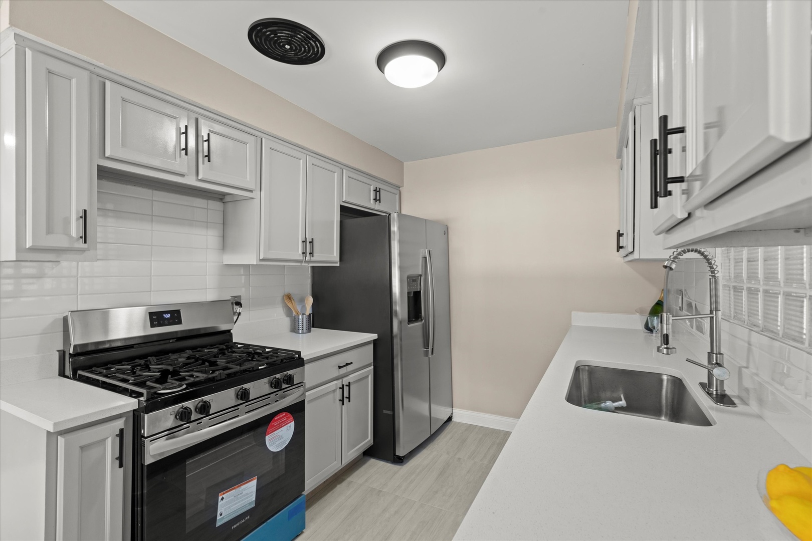 30 Broadway Chicago Heights, IL 60411 - Photo 8 of 25 a kitchen with a stove and a sink