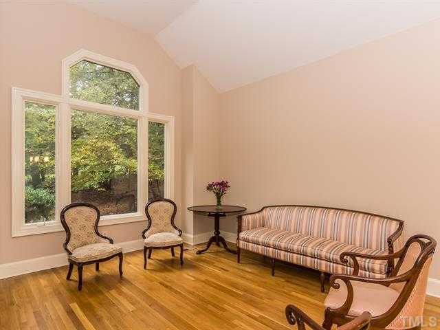 10108 Old Warden Road Raleigh, NC 27615 - Photo 3 of 25 The formal living room is directly open to the dining room and both rooms offer dramatic windows for abundant natural light! Living Room