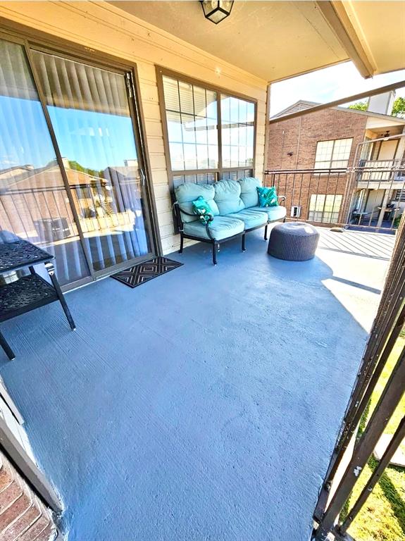 4460 Chaha Road, Unit 201 Garland, TX 75043 - Photo 13 of 16 a living room with furniture and a large window