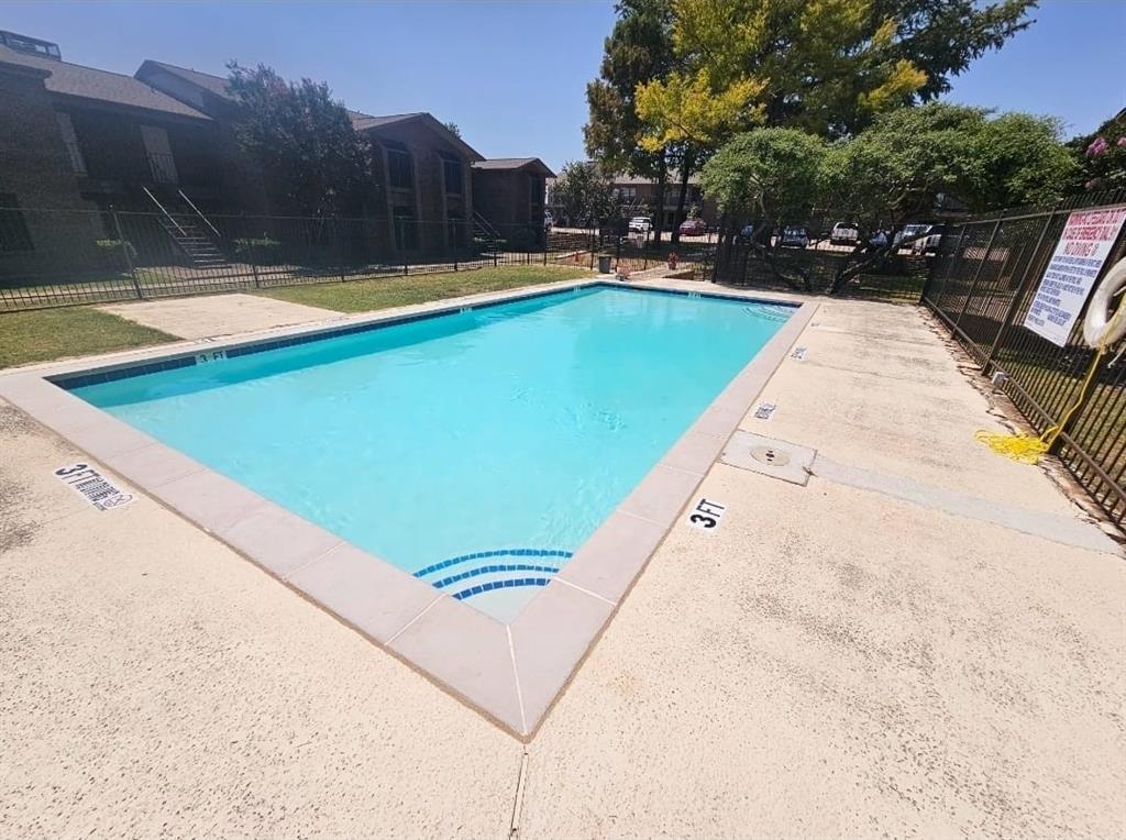 4460 Chaha Road, Unit 201 Garland, TX 75043 - Photo 14 of 16 a view of swimming pool with chairs
