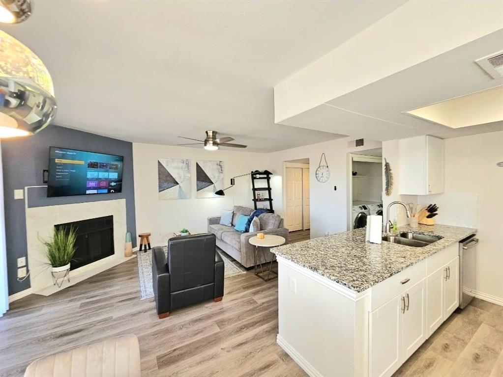 4460 Chaha Road, Unit 201 Garland, TX 75043 - Photo 6 of 16 a living room with furniture and a fireplace