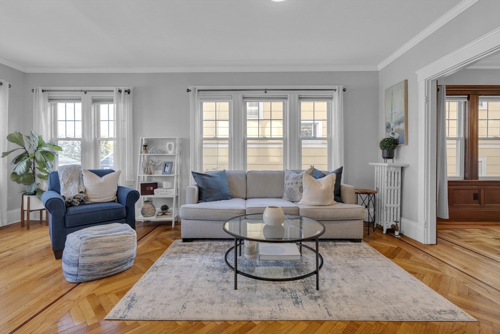 173 Train Street, Unit 1 Boston, MA 02122 - Photo 2 of 13 a living room with furniture rug and window