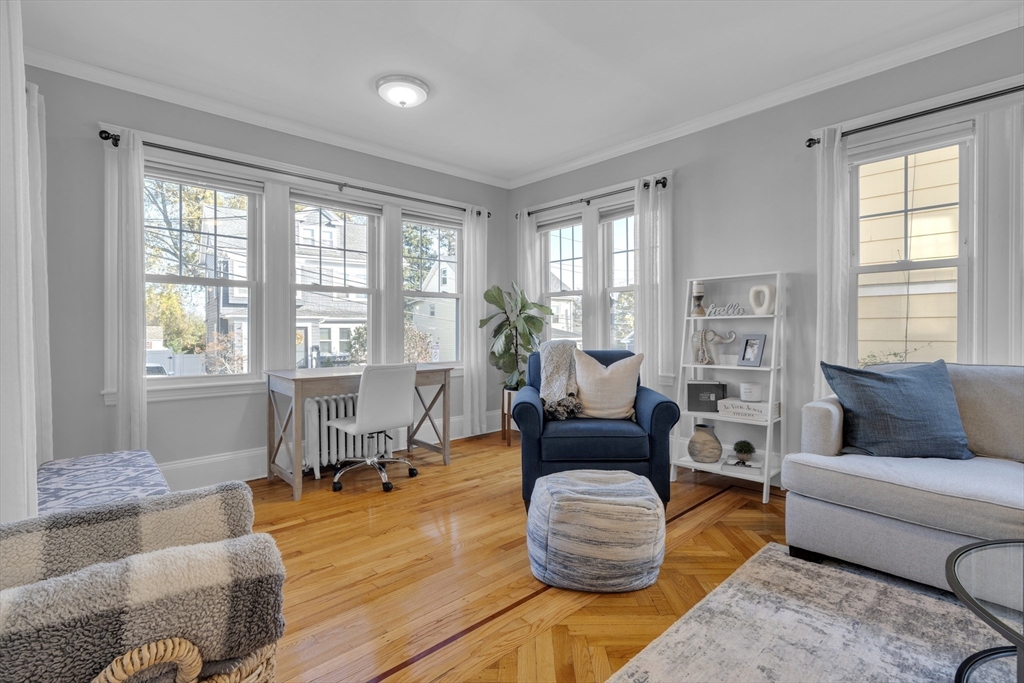 173 Train Street, Unit 1 Boston, MA 02122 - Photo 3 of 13 a living room with furniture and a large window