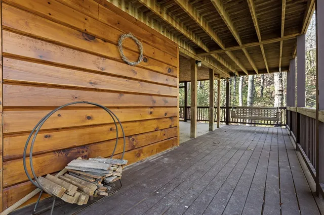 a view of a balcony with wooden floor
