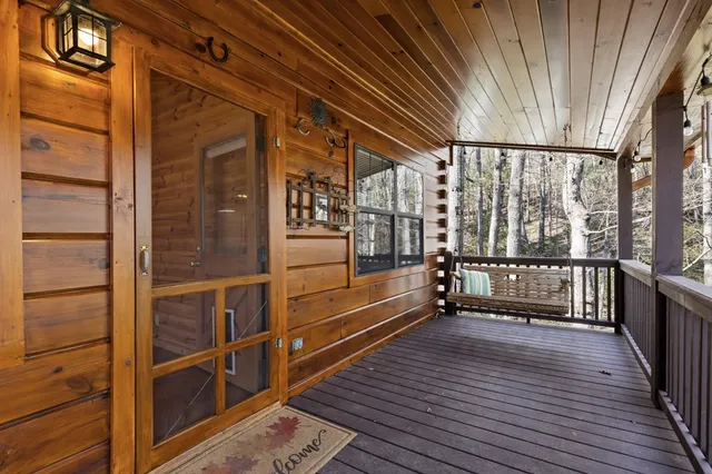 a view of a balcony with wooden floor