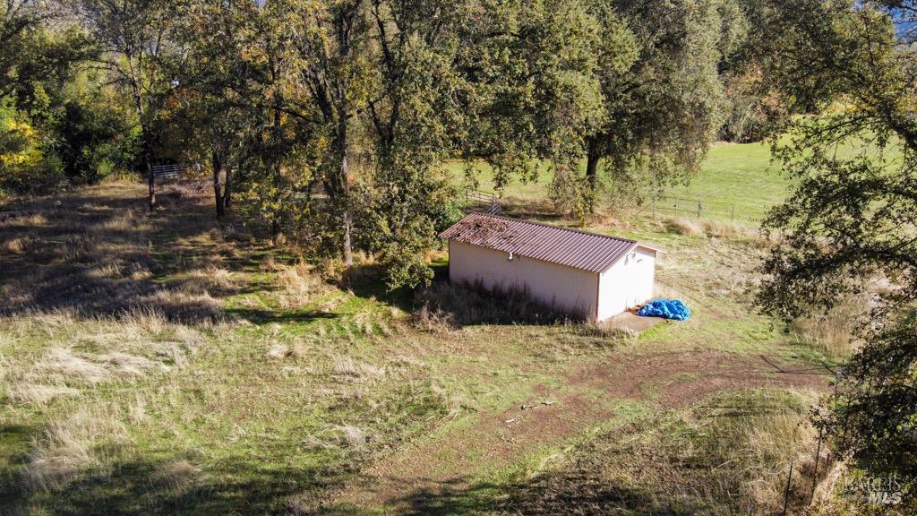 1540 Rd D Redwood Valley, CA 95470 - Photo 11 of 42 a backyard of a house with a yard and large tree