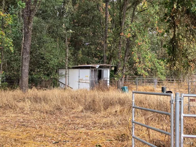 a view of a house with a trees