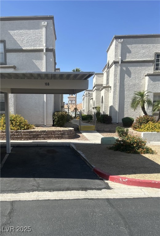 3150 North Soft Breezes Drive, Unit 1033 Las Vegas, NV 89128 - Photo 6 of 14 View of covered parking lot. Assigned stall near u